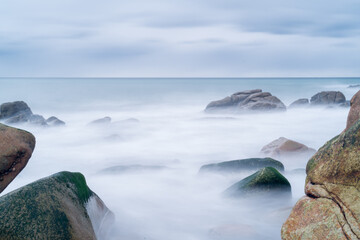 Long exposure. Seascape. Sea and rocks in Playa de La Hucha, in Arteixo, A Coruña, Galicia, Spain