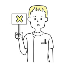 バツの書かれた札を持っている看護師