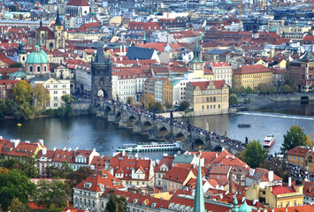 Fototapeta na wymiar Prague, Czech Republic - Aerial view of Charles Bridge, Karlův most, over the river Vltava, full of tourists, in the Prague Old Town, Staré Město. A UNESCO World Heritage Site.