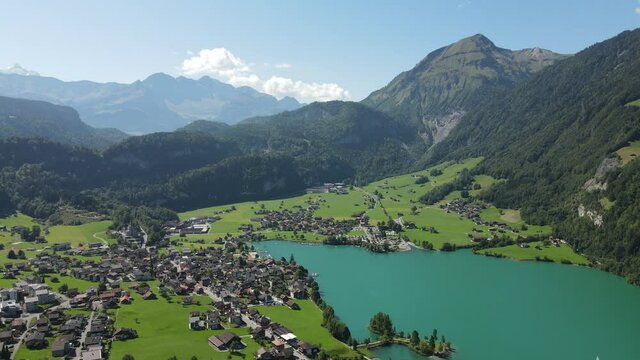 An aerial view of scenic mountains and landscapes surrounding Lungern lake, Switzerland