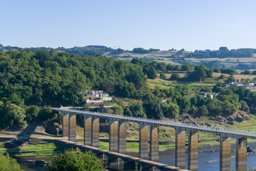 Fototapeta na wymiar New bridge over the river in Portomarín, Lugo, in The Way