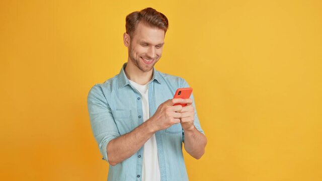 Clever charismatic blond man hold telephone chatting girlfriend look empty space