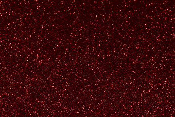 Red sparkling glitter background, christmas abstract shiny texture. Holiday lights