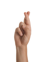 Teenage boy crossing fingers on white background, closeup