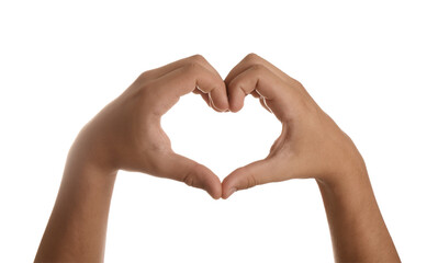 Obraz premium Teenage boy showing heart with hands on white background, closeup