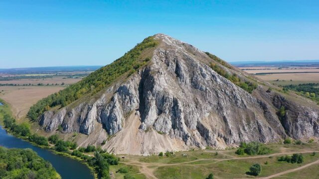 Shikhan Yuraktau - The remain of the reef of the ancient sea, composed of limestone . Indian summer in the floodplain of the Belaya River. Aerial view.