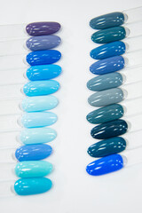 Multicolor different palette gel varnishes examples for manicure on the white background