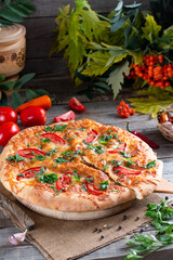 Asian fried spring rolls stuffed with vegetables on a plate and chopsticks close-up. horizontal