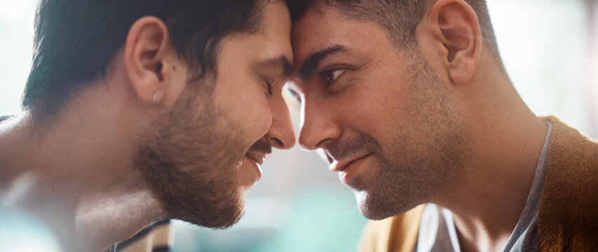 Authentic Close Up Shot of a Stylish Handsome Young Adult Gay Couple Spend Time at Home. Two Happy Men in Love in Casual Clothes Make a Gentle Headbutt. Cute LGBT Relationship Content.