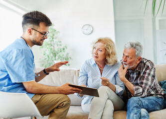 nurse doctor senior couple care caregiver help assistence retirement home nursing elderly man woman tablet technology