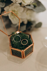 wedding rings in a glass box