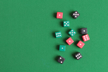 Red dice on green cloth. Items for gambling