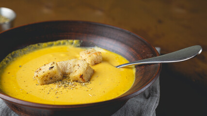 Hot autumn cream soup with vegetables and cheese