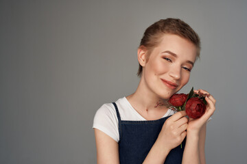 beautiful woman short haircut holding flowers modern style cropped view