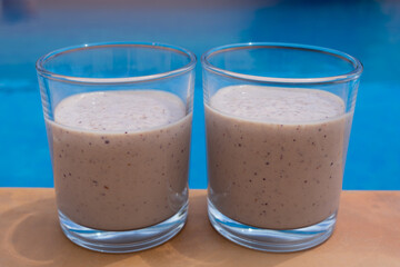 delicious fruit smoothies fresh drinks by the swimming pool food close-up for summer holidays
