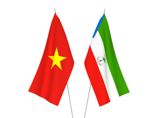 National fabric flags of Vietnam and Republic of Equatorial Guinea isolated on white background. 3d rendering illustration.