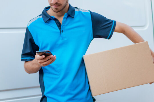 Delivery boy using the phone