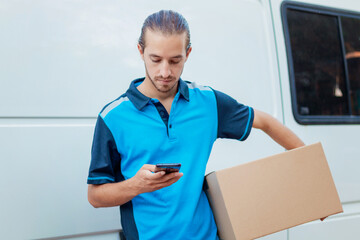Delivery boy using the phone