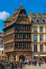 The lovely Kammerzell House, a famous building on the Place de la Cathédrale in Strasbourg. It is one of the most ornate and well preserved medieval civil housing building in late Gothic architecture. - obrazy, fototapety, plakaty