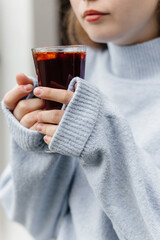 mulled wine in the hands of a girl