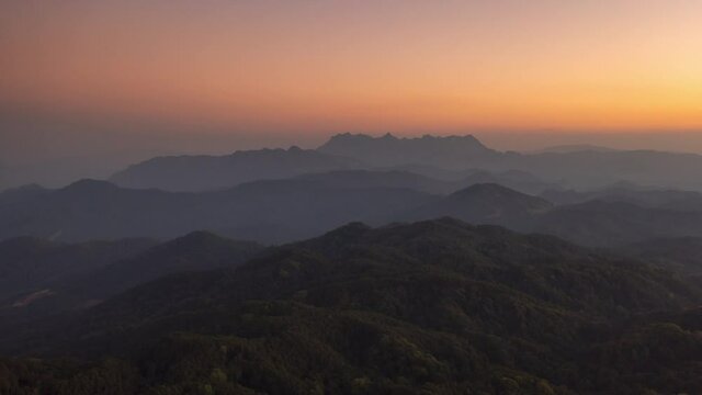 Time Lapse, a lovely winter scene. Beautiful landscape at Doi Kham Fah Viewpoint in Padaeng National Park, Chiang Mai, with Chiang Dao Mountain in the background. One of Thailand's most spectacular.