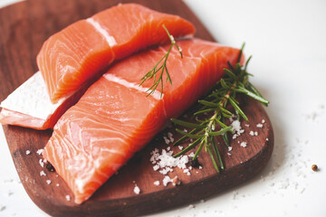 Fresh salmon fish, Raw salmon filet with lemon rosemary herbs and spices