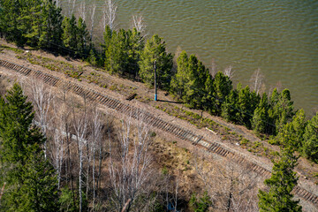 Railroad along the river bank in spring.