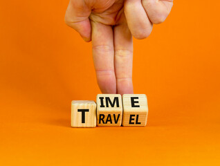 Time to travel symbol. Businessman turns wooden cubes and changes the word 'time' to 'travel' or vice versa. Beautiful orange background, copy space. Business, traveling, time to travel concept.