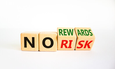 No risk or rewards symbol. Turned cubes and changed words 'no risk' to 'no rewards'. Beautiful white background. No risk or rewards and business concept. Copy space.