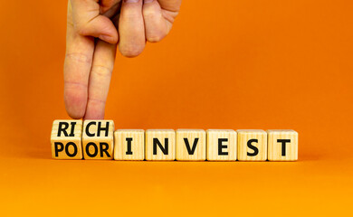 Rich or poor invest symbol. Businessman turns cubes and changes words poor invest to rich invest. Beautiful orange table, orange background, copy space. Business and rich or poor invest concept.