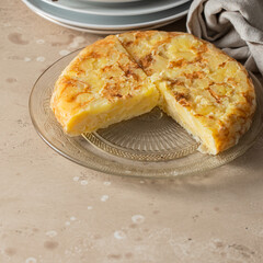 Tortilla, spanish omelette made with eggs and potatoes on the plate