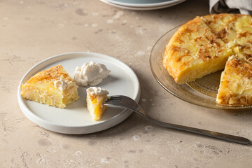 Spanish Tortilla with mayonnaise  on the  plate on restaurant table.