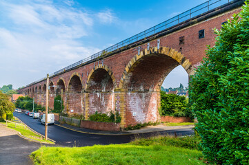 Fototapeta premium A view along the side of the railway viaduct at Yarm, Yorkshire, UK in summertime