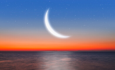Ramadan Kareem background -Crescent moon and sea at amazing sunset with lot of stars © muratart