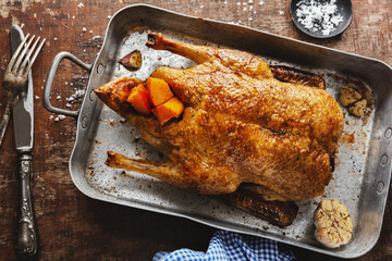 Roasted whole duck with vegetables