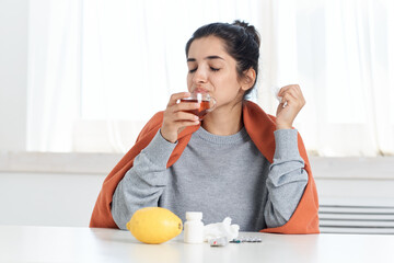 Fototapeta premium sick woman drinking medicine flu treatment infection