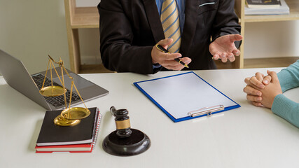 Male businessman and lawyer discussing legal matters and lawyers discuss contract documents sitting...