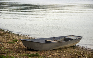 wooden boat on the Dnister river bank