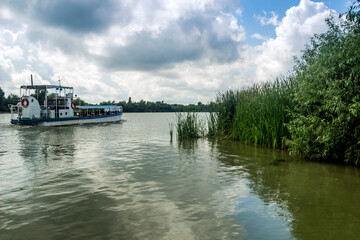 Fototapeta na wymiar small tourist boat on Danube delta