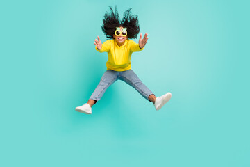 Full length body size photo woman jumping flying on wind in sunglass isolated bright teal color background