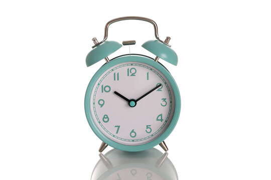 Alarm clock blue mint color for ten in morning on white background