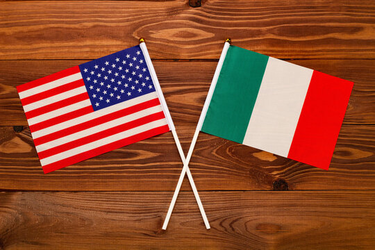 Flag of USA and flag of Italy crossed with each other. USA vs Italy EU. The image illustrates the relationship between countries. Photography for video news on TV and articles on the Internet