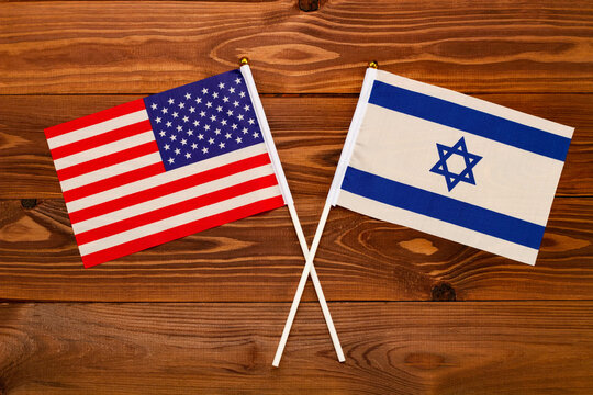 Flag of USA and flag of Israel crossed with each other. USA vs Israel. The image illustrates the relationship between countries. Photography for video news on TV and articles on the Internet and media