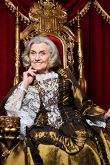 Obraz premium Portrait of beautiful senior queen on throne
