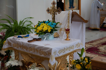 Festive altar in the church. Decorated with flowers.
