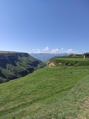 green mountains against the blue sky