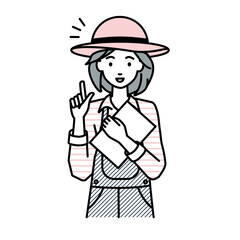 立って書類を手に持って何かひらめいた農家の女性