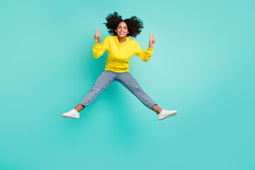 Fototapeta na wymiar Full length body size view of nice funky cheerful girl jumping showing v-sign isolated over bright teal turquoise color background