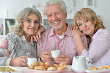 Close up portrait of senior people drinking tea