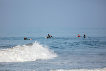 A California Beach with Surfers Riding the Waves